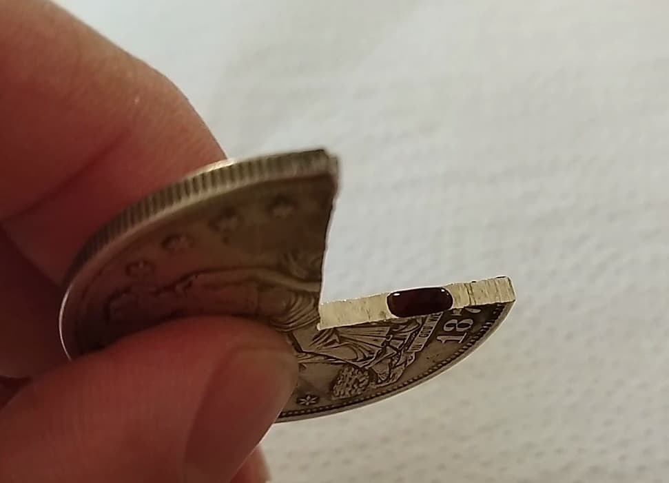 Acid drop on the cut cross-section turning dark red